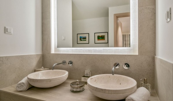 Double sink, towels and mirror in the bedroom in the luxury villa Korcula Prestige on the island of Korcula