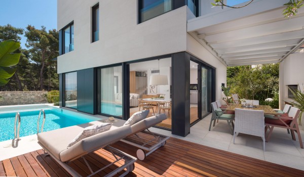 Sunbathing area by the sea in luxury holiday modern villa Sutivan with private pool.