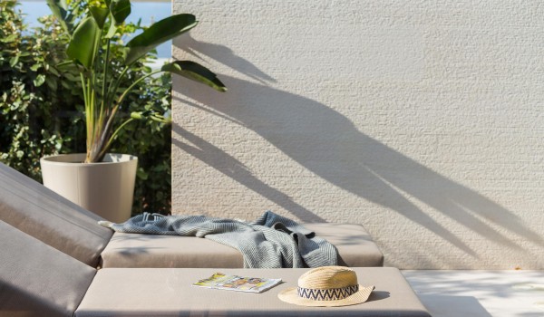 Cozy deck chair on the terrace of Sutivan luxury holiday private villa with pool by the sea.