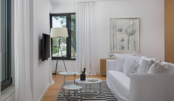 Modern living room with cozy sofa and sea view in Sutivan luxury family villa with private pool by the beach.