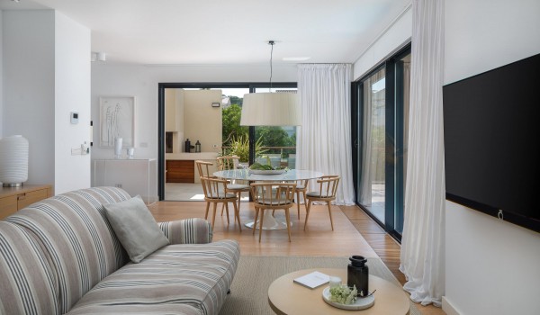 Modern living room with cozy sofa and sea view in Sutivan luxury family villa with private pool by the beach.