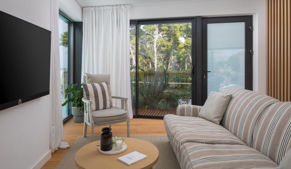 Modern living room with cozy sofa and sea view in Sutivan luxury family villa with private pool by the beach