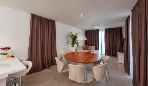 Modern interior of living room with dining area on the ground floor of a Croatia luxury villa Trogir 2 with pool and parking