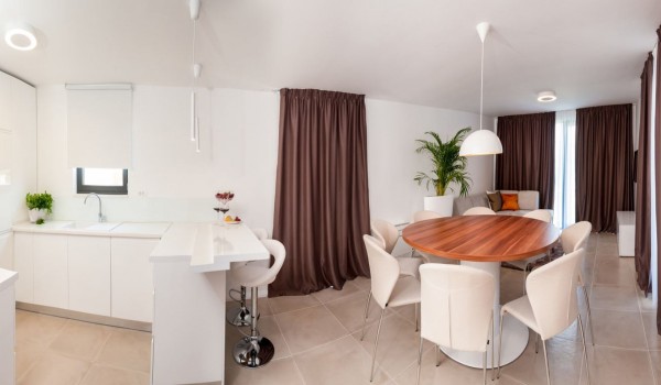 Modern interior of living room with dining area on the ground floor of a Croatia luxury villa Trogir 2 with pool and parking