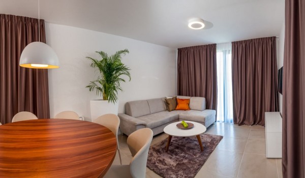 Comfortable sofa with coffee table in the living room of a Croatia luxury vacation villa with private pool and sauna in Trogir