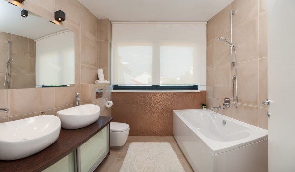 En suite bathroom with bathtub in a Croatia luxury vacation villa with private pool and gym in Trogir