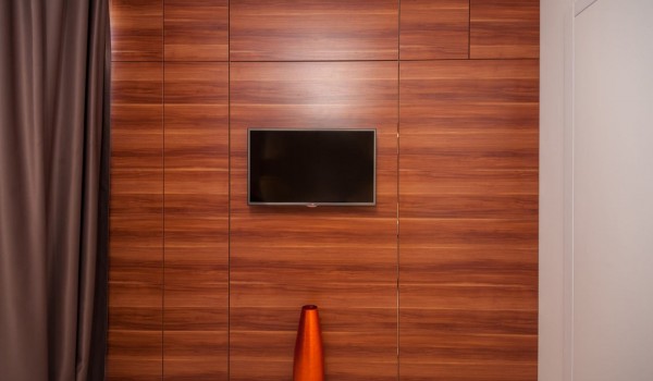 LCD TV in a bedroom with en suite bathroom of a Croatia luxury villa Trogir 2 for vacation and rent on Ciovo