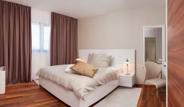 King-size bed in the bedroom of a Croatia luxury family villa for vacation and rent in Trogir