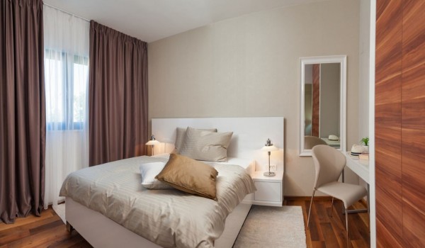 King-size bed in the bedroom of a Croatia luxury family villa for vacation and rent in Trogir