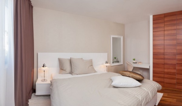 King-size bed in the bedroom of a Croatia luxury family villa for vacation and rent in Trogir