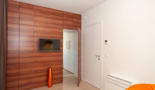 LCD TV in a bedroom with en suite bathroom of a Croatia luxury villa Trogir 1 for vacation and rent on Ciovo