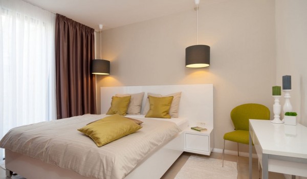 King size bed in a bedroom of a Croatia luxury pool villa for vacation with friends on Ciovo