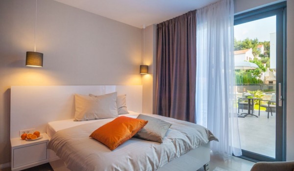 King size bed in a bedroom of a Croatia luxury family villa with private pool and gym in Trogir