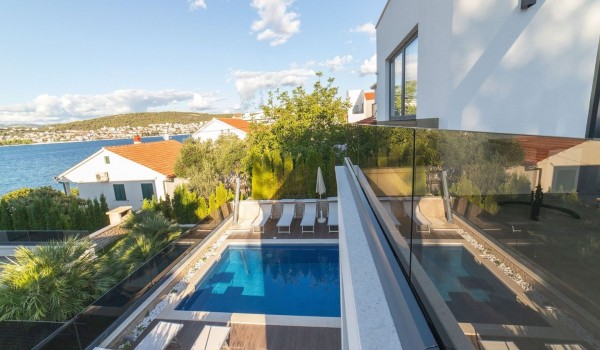 View of the private terrace with pool and sun loungers of a Croatia luxury vacation villa Trogir 2 by the sea