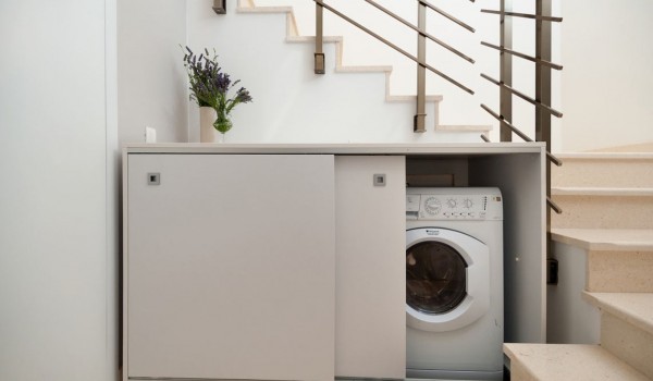 Closet with washing machine under internal stairs in Croatia luxury villa Trogir 2 with pool and sea view