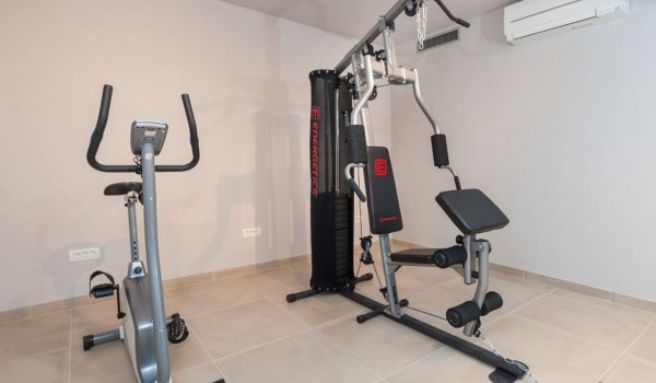 Exercise equipment in the private gym in a croatia luxury  modern villa Trogir 2 with sea view and pool