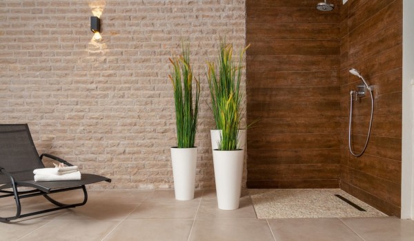 Loungers next to the walk-in shower in a Croatia luxury family villa with private sauna and gym