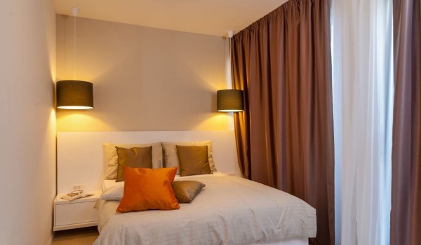 King size bed in a bedroom of a Croatia luxury family villa with private pool and gym in Trogir