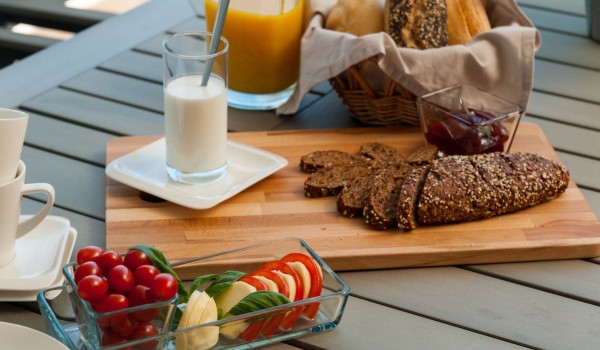 Breakfast on the outdoor table of a Croatia luxury modern villa with pool for rent in Trogir