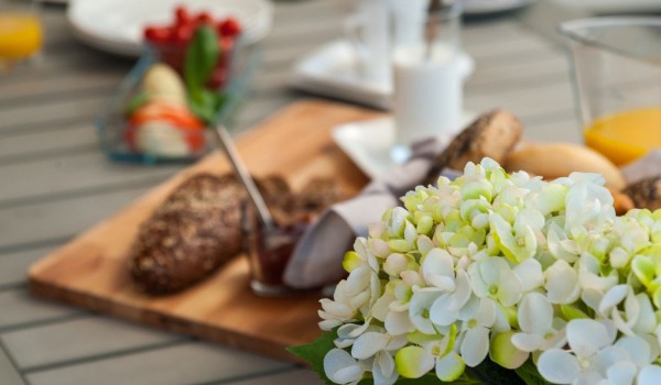 Breakfast on the outdoor table of a Croatia luxury modern villa with pool for rent in Trogir