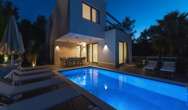 Night view of a Croatia luxury seafront villa Trogir 2 with private pool and sauna for vacation with friends or family