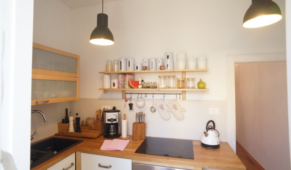 Wooden kitchen on the ground floor of rental villa in Orebić equipped with oven, coffee maker, kettle