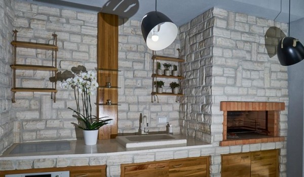 Summer kitchen on the terrace of a luxury Dubrovnik villa for family vacation near the sea with total privacy