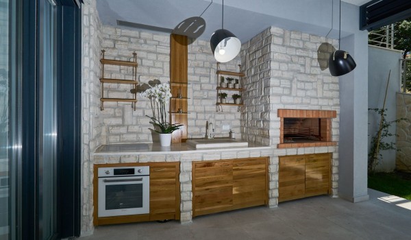Summer kitchen on the terrace of a luxury Dubrovnik villa for family vacation near the sea  with total privacy
