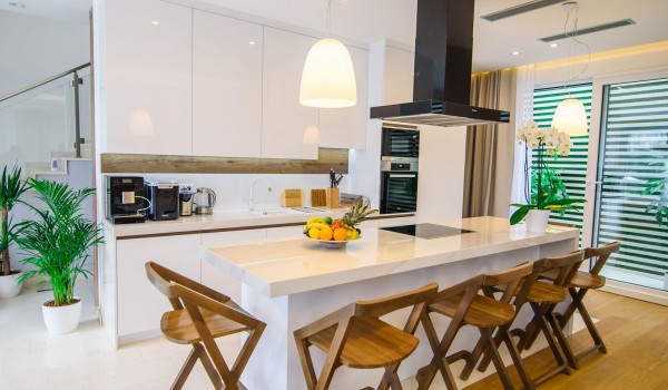 Elegant kitchen with kitchen island in a luxury Croatian villa for family vacation near the sea with total privacy