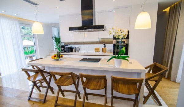 Elegant kitchen with kitchen island in a luxury Croatian villa for family vacation near the sea with total privacy