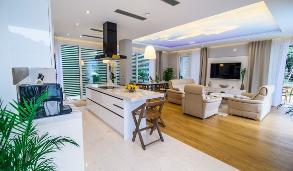 Living room with comfortable sofas and dining table in a luxury Dubrovnik villa with private parking and wifi