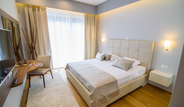 King size bed in an elegant bedroom of a luxury vacation villa Grandiosa with private pool and parking