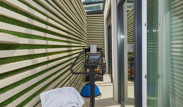Exercise bike in a luxury vacation villa with concierge service and pakring