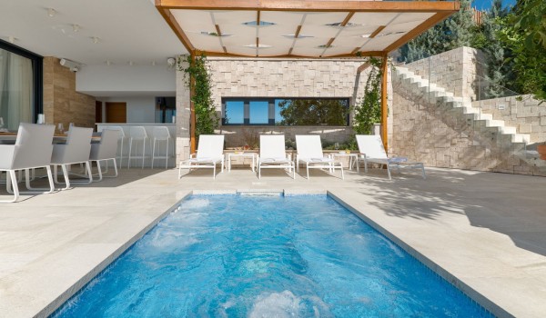 Luxury family villa Hvar Fantasy in Hvar with summer kitchen and dining area on the private terrace with pool