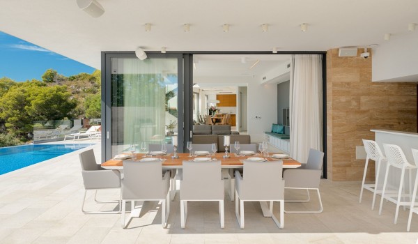 Dining area and pool on the private terrace of the luxury family villa Hvar Fantasy overlooking the beach and the sea