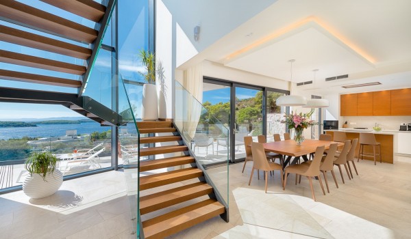 Inside of the luxurious villa Hvar Fantasy with the fully equipped kitchen and the open staircase with the view at the sea