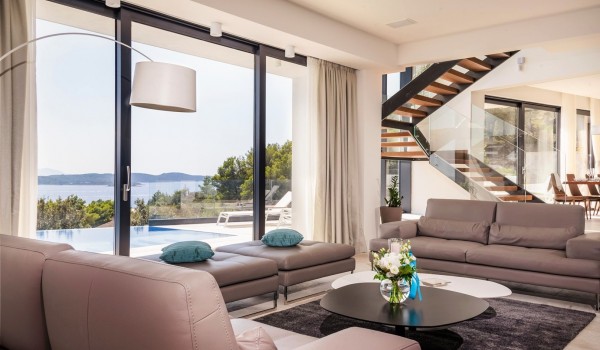 Living room area with the view at the private terrace of the luxurious villa Hvar Fantasy with the private pool overlooking the sea