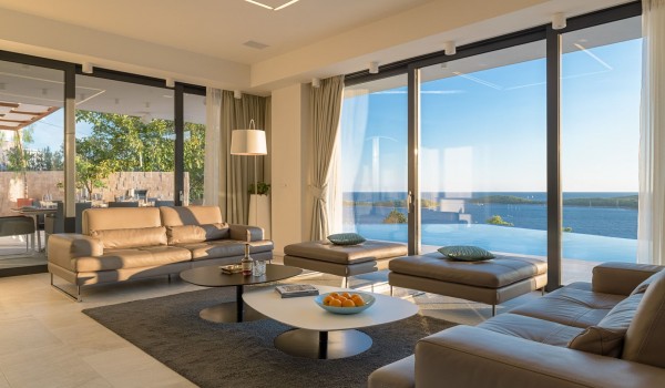 Living room area with the view at the private terrace of the luxurious villa Hvar Fantasy with the private pool overlooking the sea