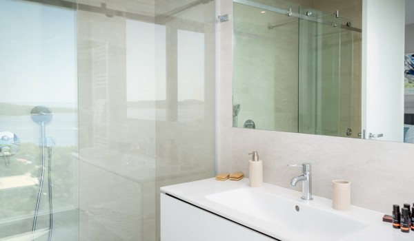 Inside of the luxury bathroom with the big shower cabin and the mirrors in the family villa Hvar Fantasy for vacation and rent