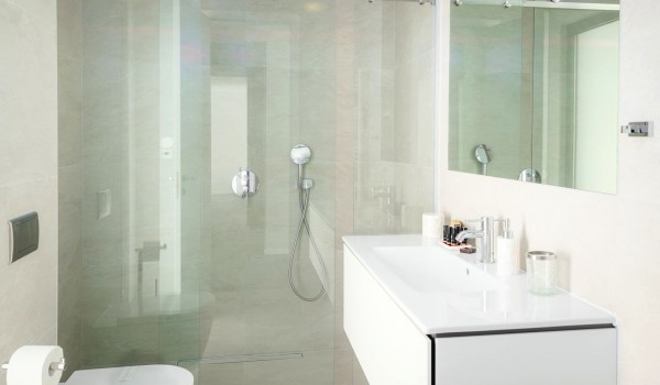 Inside of the luxury bathroom of villa Hvar Fantasy with the shower cabin and sink with mirror designed for vacation and rent