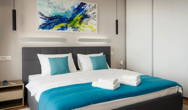 Bedroom with the king size bed and wardrobe in the luxury family villa Hvar Fantasy for vacation and rent