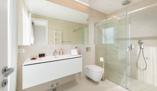 Inside of the luxury bathroom of villa Hvar Fantasy with the shower cabin and sink with mirror designed for vacation and rent