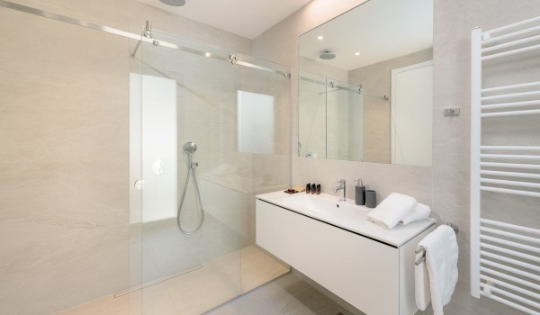 Inside of the luxury bathroom of villa Hvar Fantasy with the shower cabin and sink with mirror designed for vacation and rent