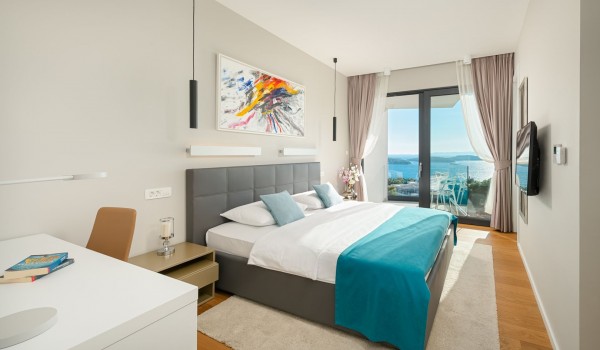 Bedroom of the luxury villa Hvar Fantasy with the reading corner and the private balcony with the lounge area perfect for enjoying the sea view