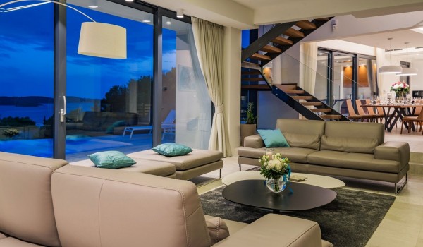 Living room area with the view at the private terrace of the luxurious villa Hvar Fantasy with the private pool overlooking the sea