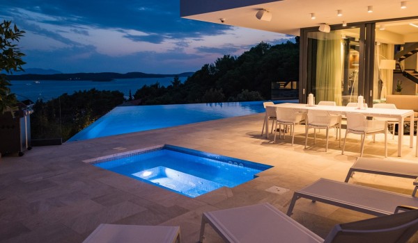Night view of the private terrace with heated pool in the villa Hvar Fantasy overlooking the sea in Hvar