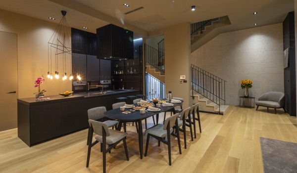 Fully equipped kitchen area of Croatia luxury rental villa with dining table connected to the living room
