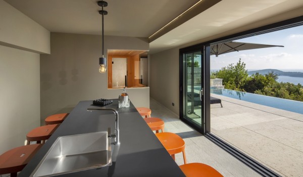 Summer kitchen of Croatia luxury pool villa with the exit on the private terrace with private pool