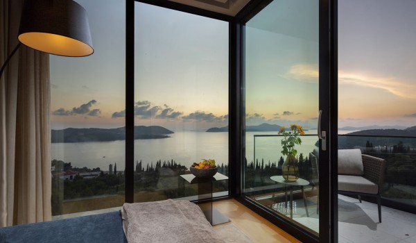 Master bedroom of Croatia luxury villa for rent with king-size bed and private balcony overlooking the sea