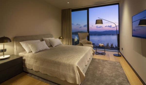 Bedroom of the luxury Dalmatia villa Elena with king-size bed and reading corner for family vacation